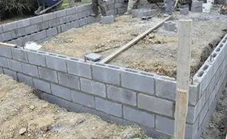 Professionals building a foundation with blocks in Colorado Springs, CO