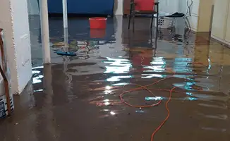 Basement with boiler, cabinets and washing machine completely flooded in Colorado Springs, CO